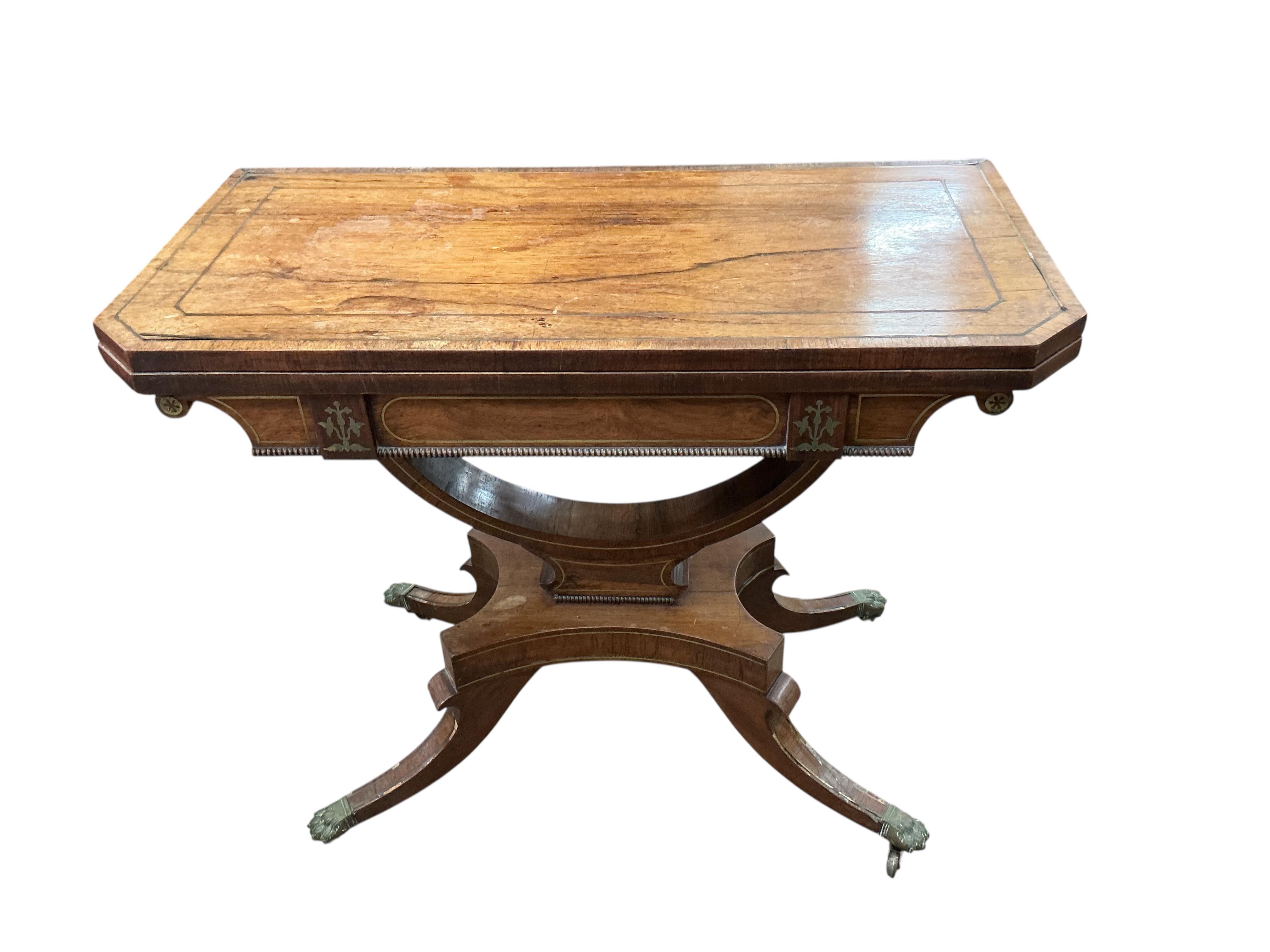 A Regency brass mounted rosewood folding card table, width 89cm, depth 44cm, height 74cm